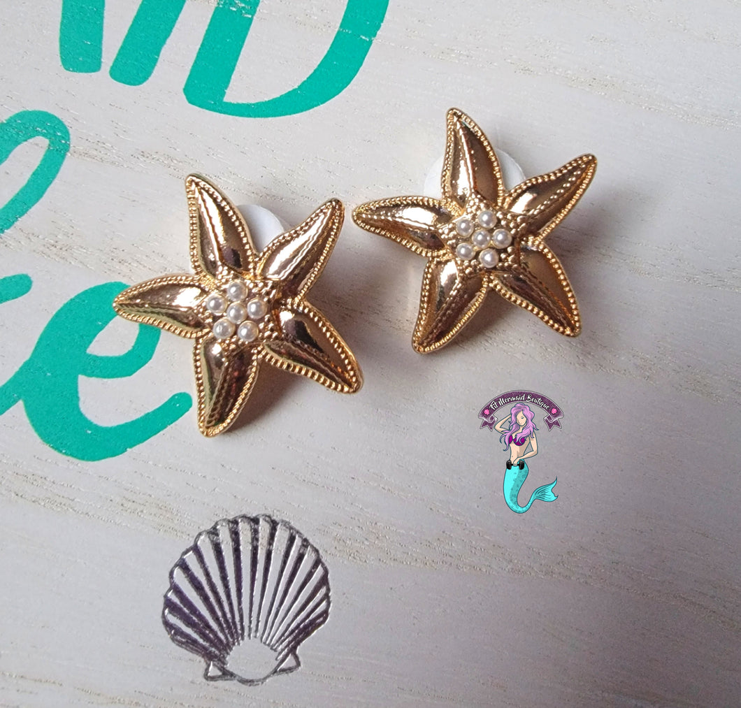 Gold starfish earrings (clip)